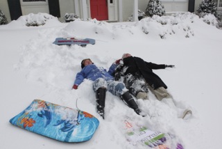 Mom and John making snow angels - Golden bachelor fans, eat your heart out!